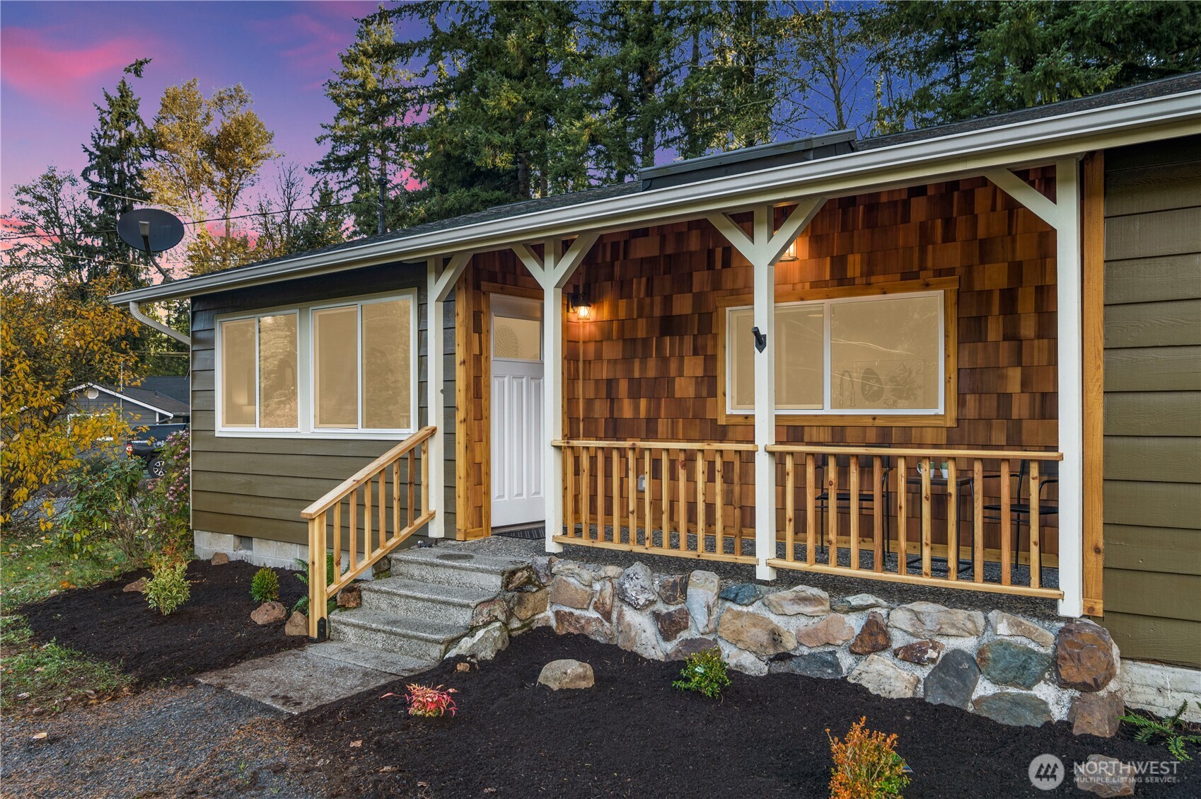 a view of a small house with a yard