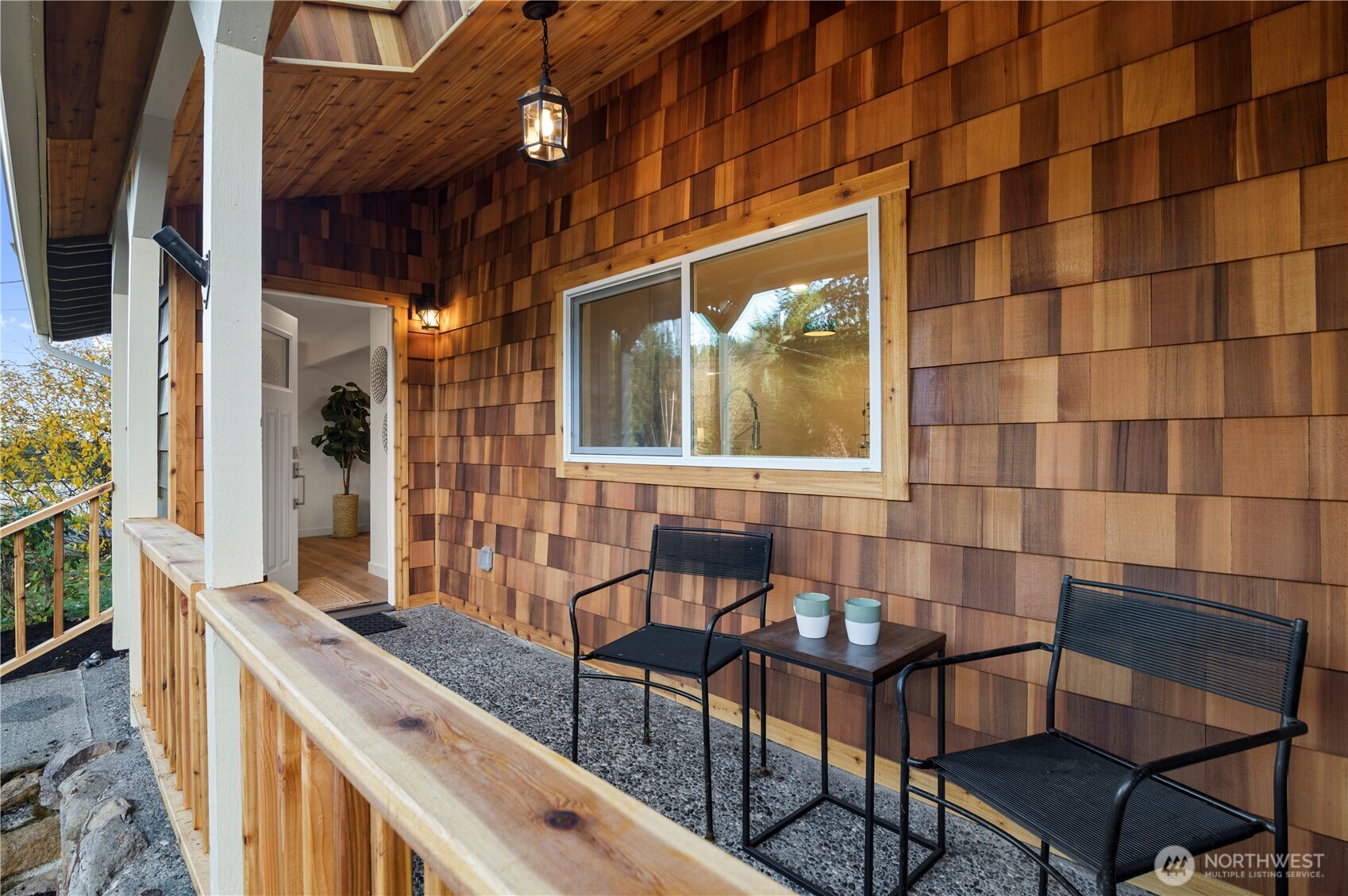 20909 Frank Waters Road Stanwood, WA 98292 - Photo 4 of 24 a couple of chairs sitting in front of a building