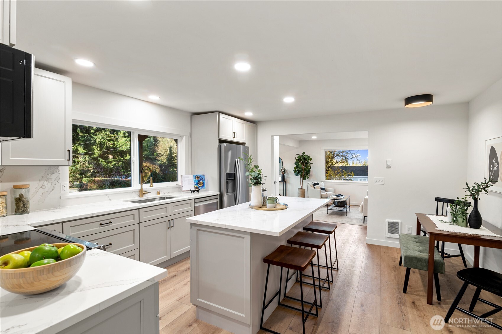 20909 Frank Waters Road Stanwood, WA 98292 - Photo 7 of 24 a large kitchen with a table and chairs in it
