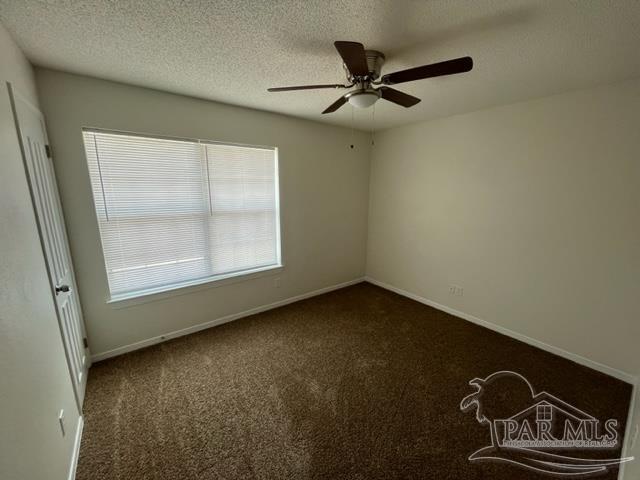 10154 Vixen Place Pensacola, FL 32514 - Photo 9 of 12 an empty room with windows
