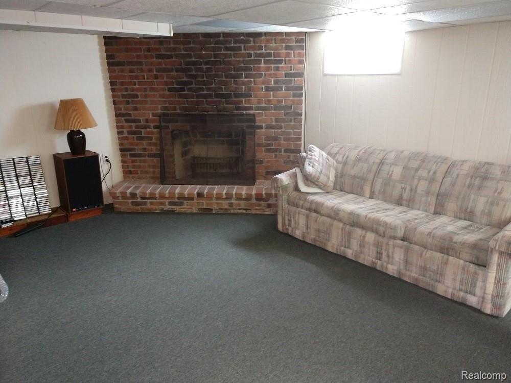 8940 Ruth Avenue Allen Park, MI 48101 - Photo 28 of 33 BASEMENT RECREATION ROOM WITH FIREPLACE, THREE PIECE BATH AND WET BAR. PLEANTY OF STORAGE.