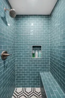 a bathroom with a sink toilet a shower and a mirror