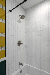 a bathroom with a shower and a bathtub