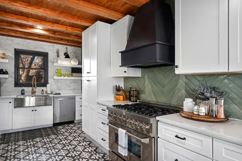 a kitchen with a stove and a sink