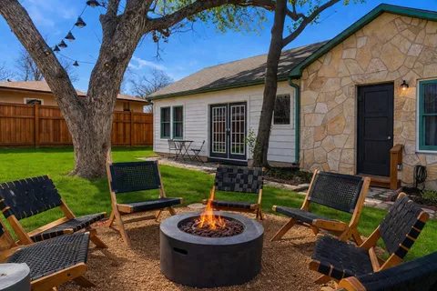 a view of a backyard with plants and a patio