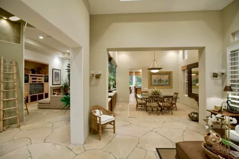 a lobby with furniture and a potted plant
