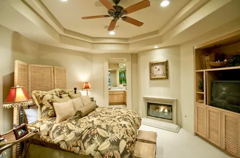 a bed room with a bed and a fireplace