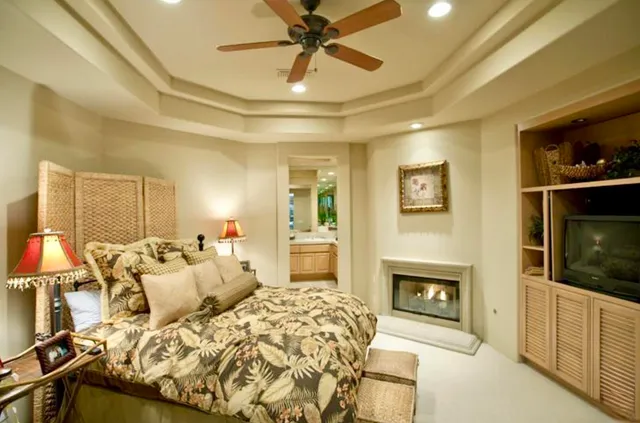 a bed room with a bed and a fireplace