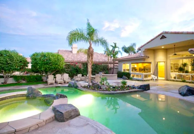 a view of a swimming pool with a patio