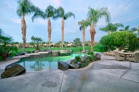 a view of a garden with a bench and a garden