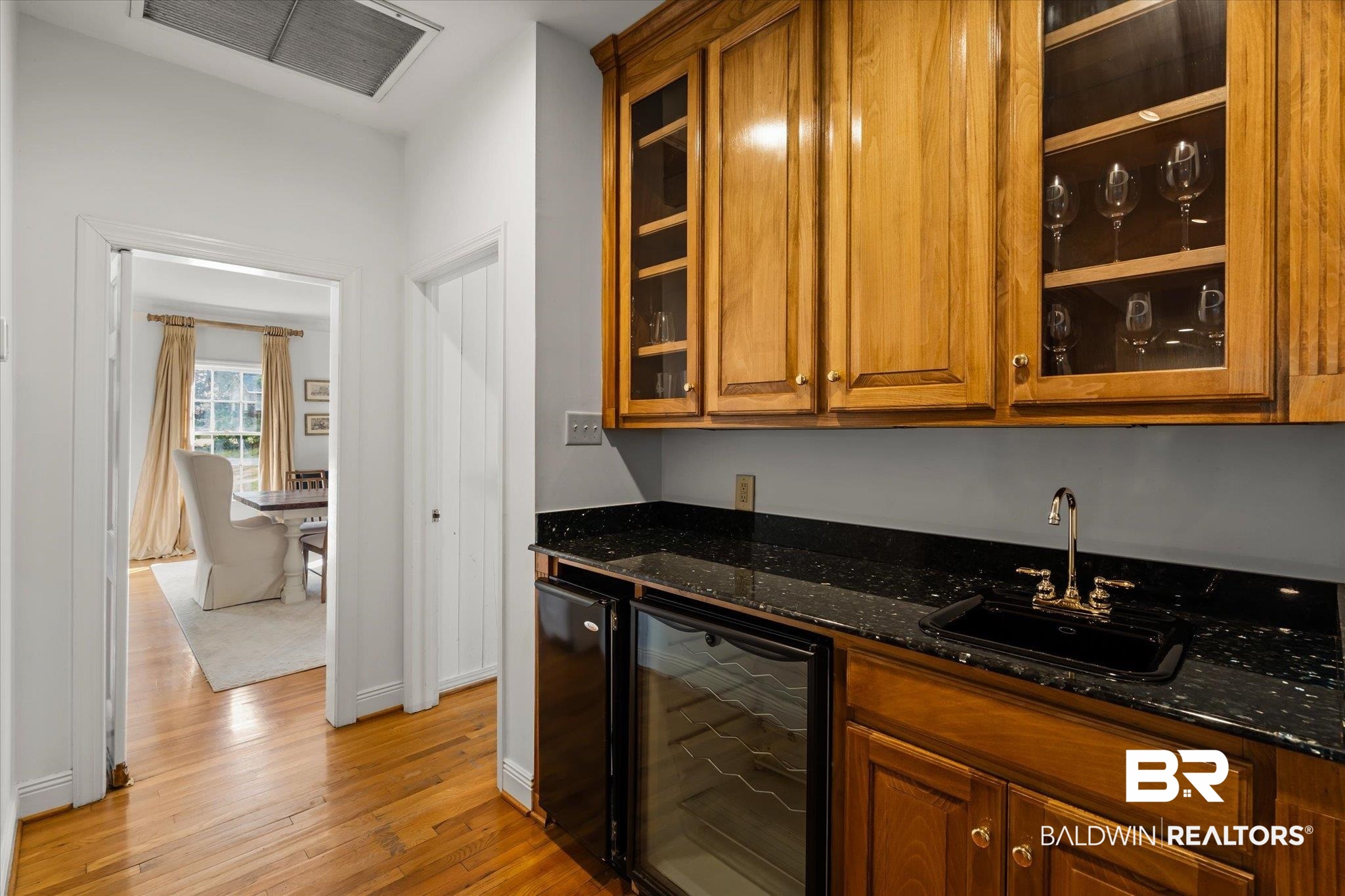 143 Myrtlewood Lane Mobile, AL 36608 - Photo 7 of 55 Bar featuring visible vents, beverage cooler, light wood-style flooring, a sink, and indoor wet bar