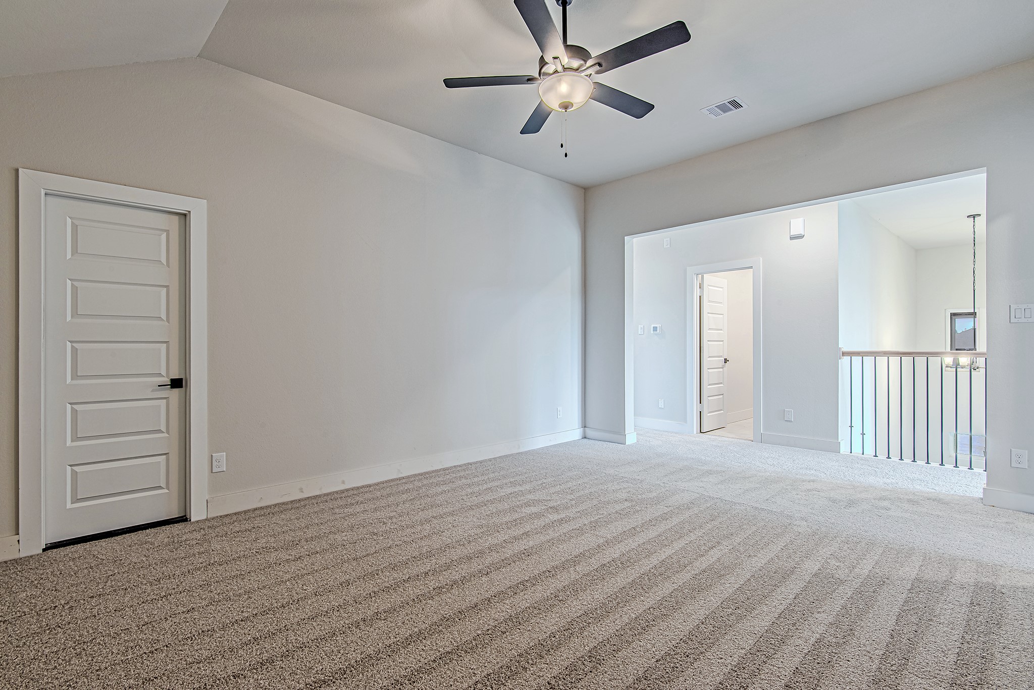141 Peninsula Point Drive Montgomery, TX 77356 - Photo 31 of 47 An upstairs game room or media flex space with vaulted ceilings, fresh neutral carpet, and convenient access to adjoining bedrooms and attic storage.