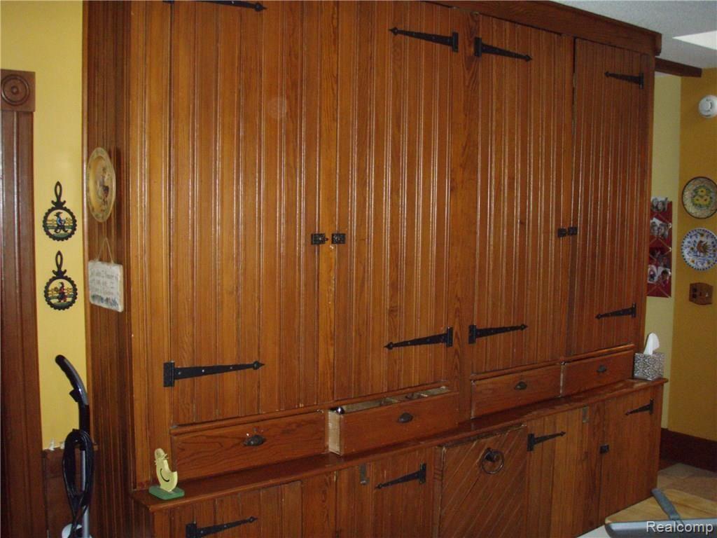 11754 Merrill Road Whitmore Lake, MI 48189 - Photo 18 of 42 Original Wall Of Cupboards Now Used As a Pantry