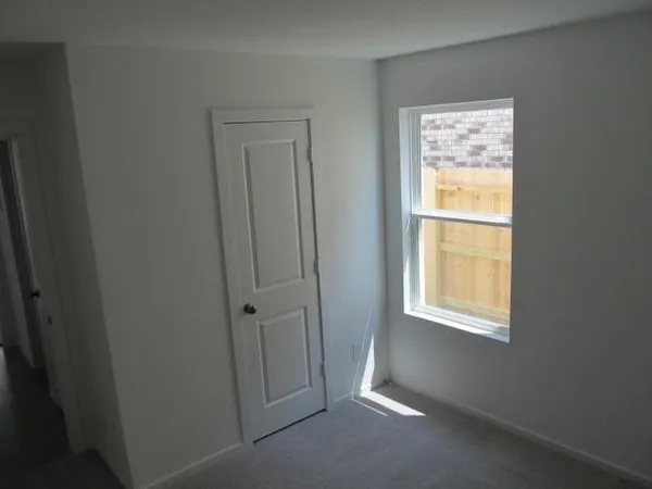 a white toilet sitting next to a white sink
