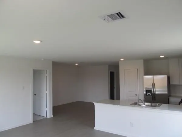 a kitchen with stainless steel appliances a refrigerator stove microwave and sink