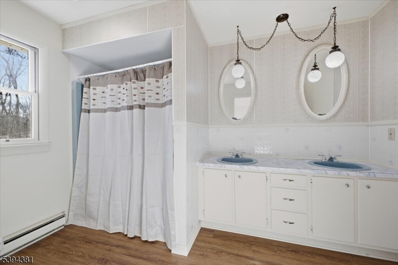 192 Bryans Road Hampton, NJ 08827 - Photo 12 of 38 a bathroom with a granite countertop double vanity sink and a mirror
