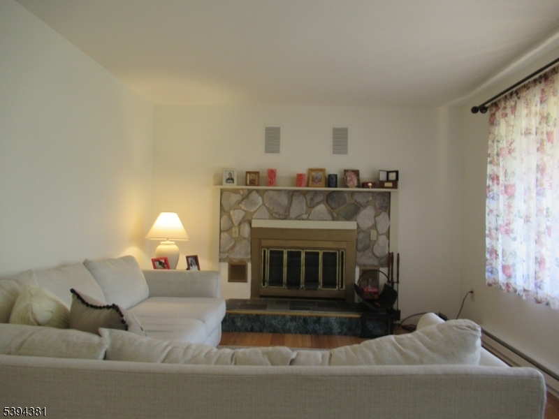 192 Bryans Road Hampton, NJ 08827 - Photo 13 of 32 a living room with furniture and a fireplace
