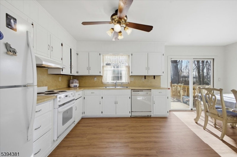 192 Bryans Road Hampton, NJ 08827 - Photo 4 of 38 a kitchen with a stove top oven sink and cabinets