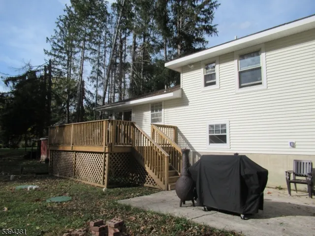 a view of a house with a back yard