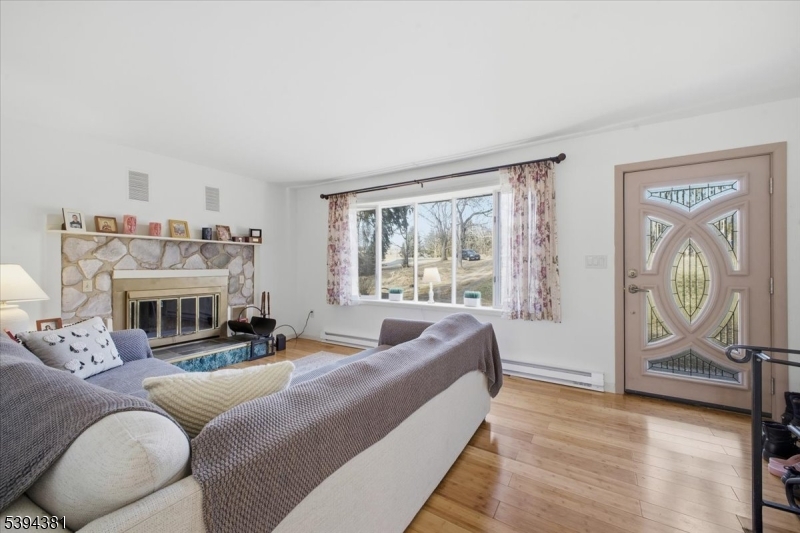 192 Bryans Road Hampton, NJ 08827 - Photo 9 of 38 a living room with furniture and a fireplace
