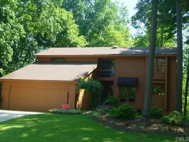 6203 Lookout Loop Raleigh, NC 27612 - Photo 1 of 11 a front view of a house with garden