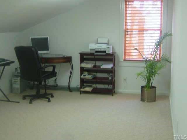 6203 Lookout Loop Raleigh, NC 27612 - Photo 6 of 11 a view of a workspace with furniture and a window
