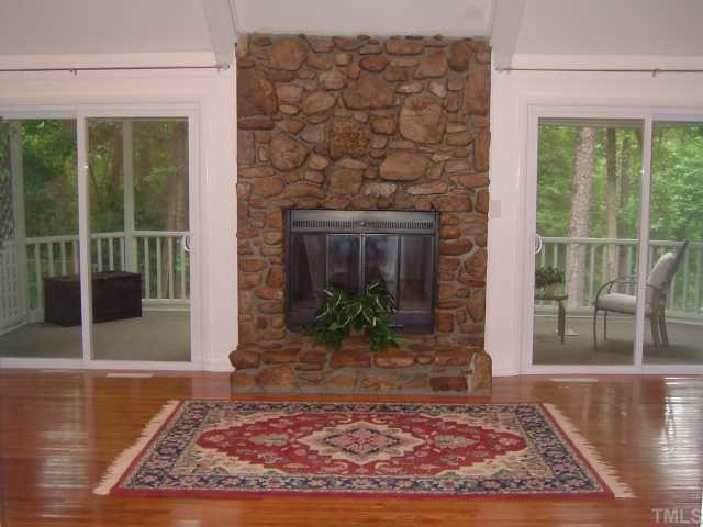 6203 Lookout Loop Raleigh, NC 27612 - Photo 8 of 11 a view of a livingroom with a fireplace and window