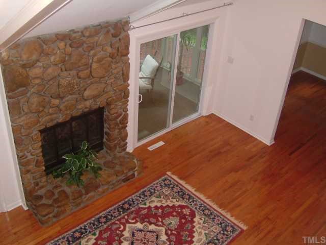 6203 Lookout Loop Raleigh, NC 27612 - Photo 10 of 11 a view of wooden floor in a room