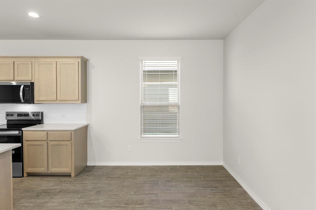 1713 Teton River Drive Blue Ridge, TX 75424 - Photo 14 of 29 a view of a kitchen with a sink cabinets and a window