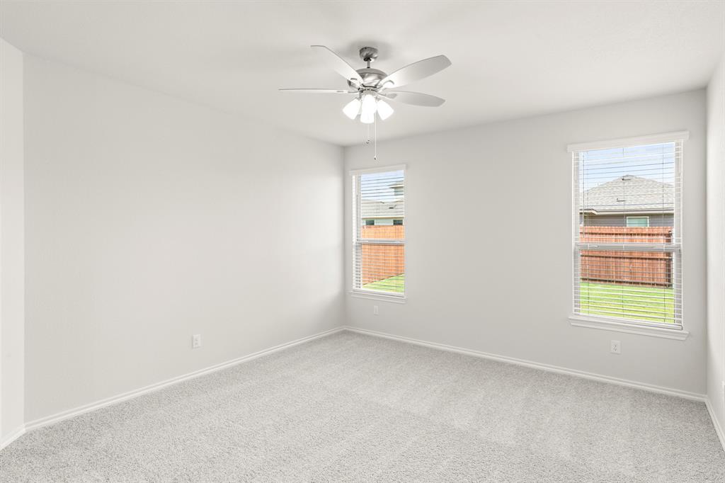 1713 Teton River Drive Blue Ridge, TX 75424 - Photo 15 of 29 an empty room with a window and a ceiling fan