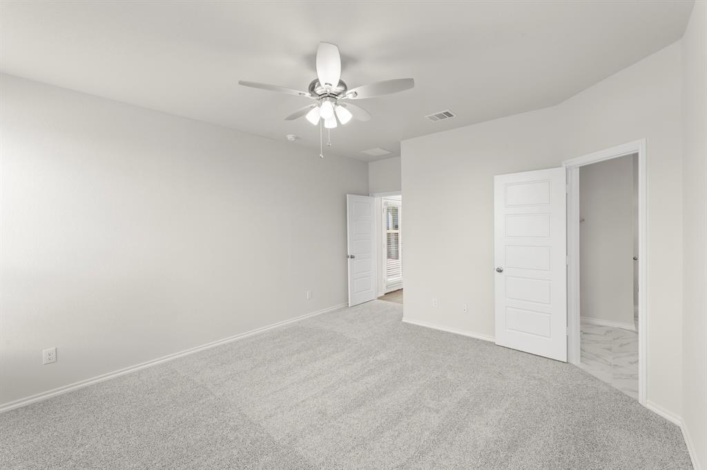 1713 Teton River Drive Blue Ridge, TX 75424 - Photo 16 of 29 a view of an empty room with a chandelier fan