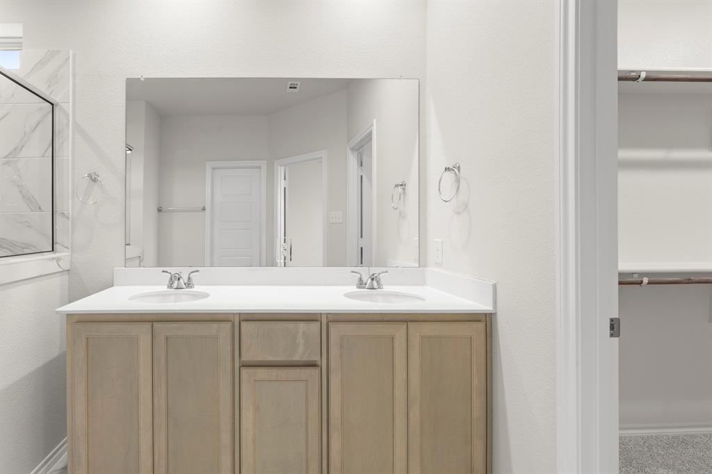 1713 Teton River Drive Blue Ridge, TX 75424 - Photo 17 of 29 a bathroom with a sink and a mirror