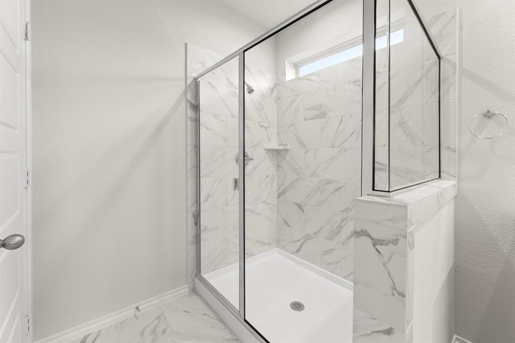 1713 Teton River Drive Blue Ridge, TX 75424 - Photo 19 of 29 a bathroom with a glass shower door