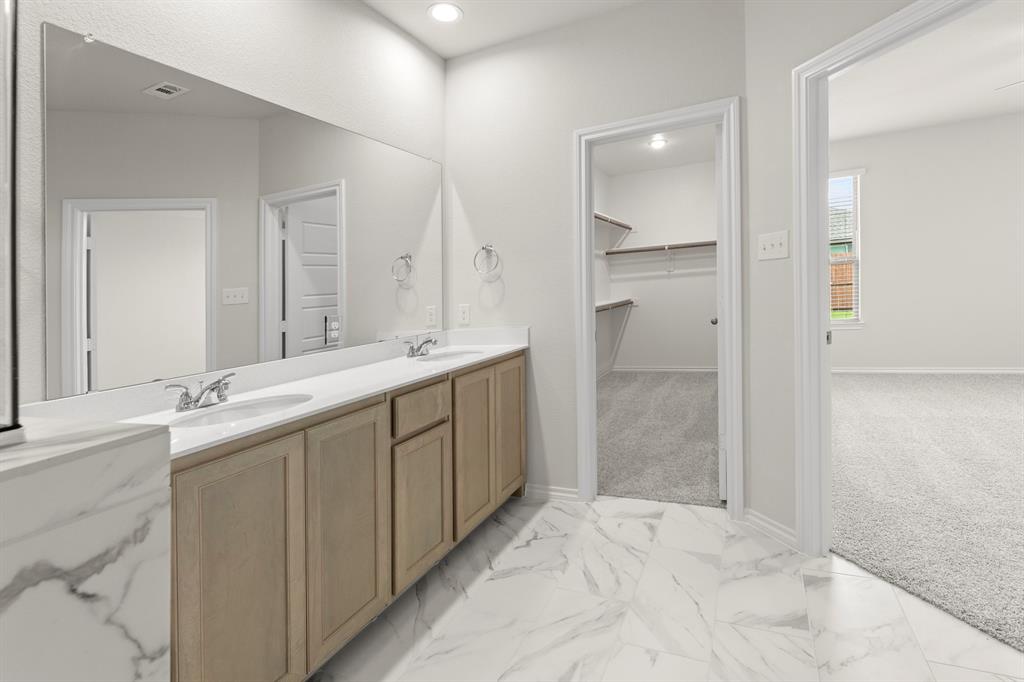 1713 Teton River Drive Blue Ridge, TX 75424 - Photo 20 of 29 a bathroom with a granite countertop sink mirror and double