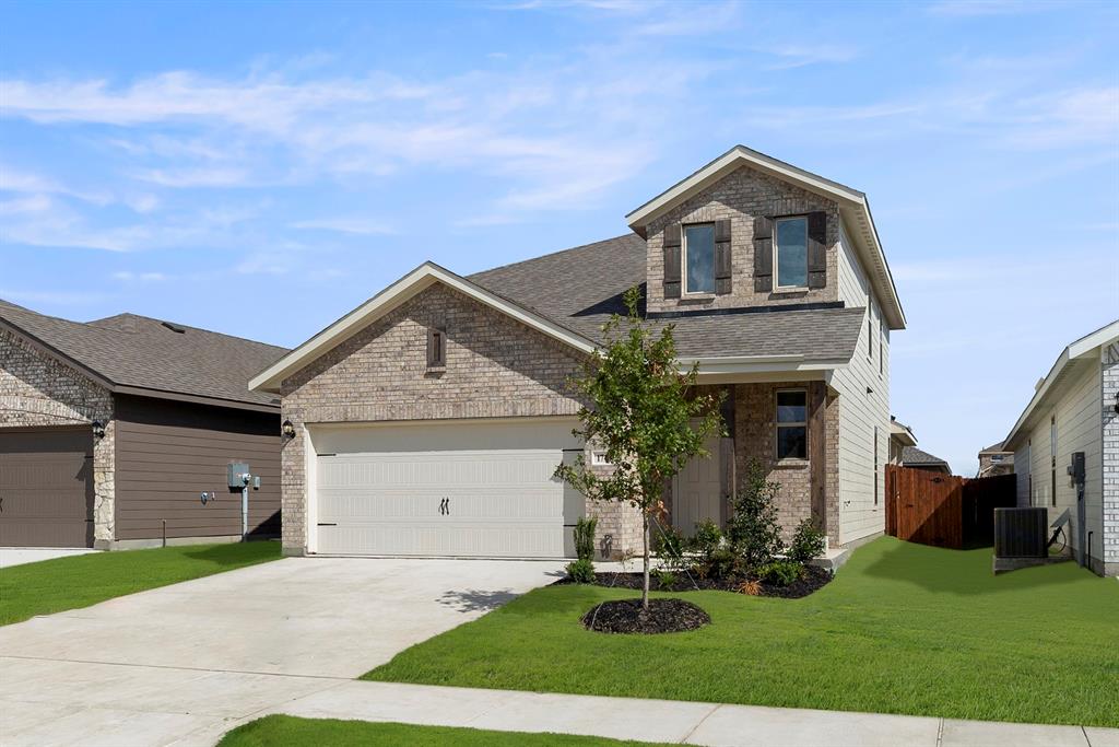 1713 Teton River Drive Blue Ridge, TX 75424 - Photo 2 of 29 a front view of a house with a yard and garage