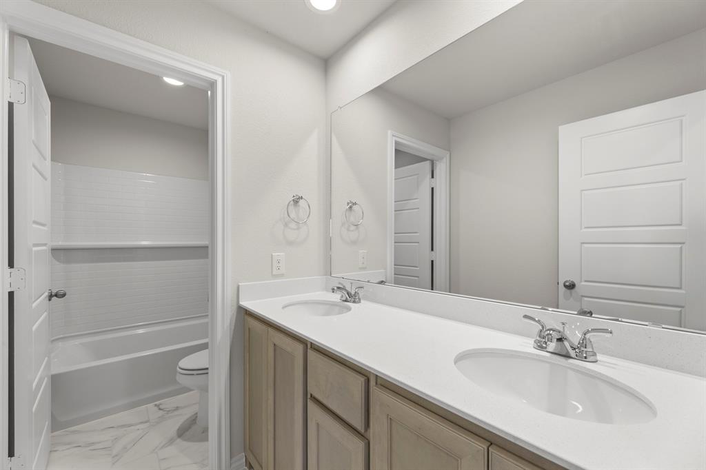 1713 Teton River Drive Blue Ridge, TX 75424 - Photo 23 of 29 a bathroom with a sink and a mirror