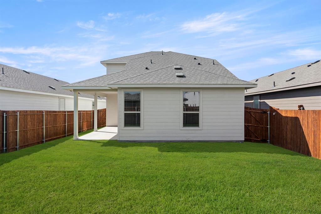 1713 Teton River Drive Blue Ridge, TX 75424 - Photo 28 of 29 a view of a house with a yard and garage