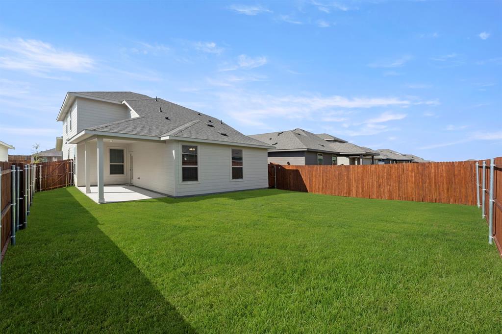 1713 Teton River Drive Blue Ridge, TX 75424 - Photo 29 of 29 a view of a yard with a house in the background