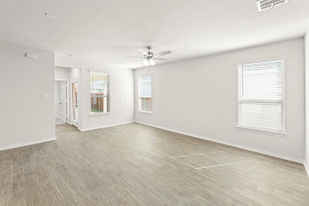 1713 Teton River Drive Blue Ridge, TX 75424 - Photo 7 of 29 wooden floor in an empty room with a window