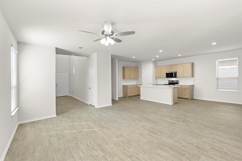 1713 Teton River Drive Blue Ridge, TX 75424 - Photo 8 of 29 a view of a kitchen with a sink and a refrigerator
