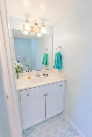a bathroom with a sink and mirror