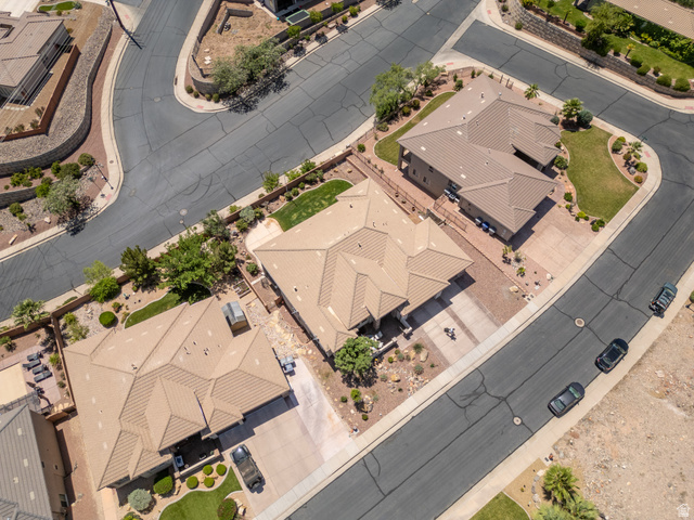 2005 West 450 S Circle St. George, UT 84770 - Photo 53 of 57 Aerial perspective showcasing three properties with tan-colored tile roofing and mature landscaping