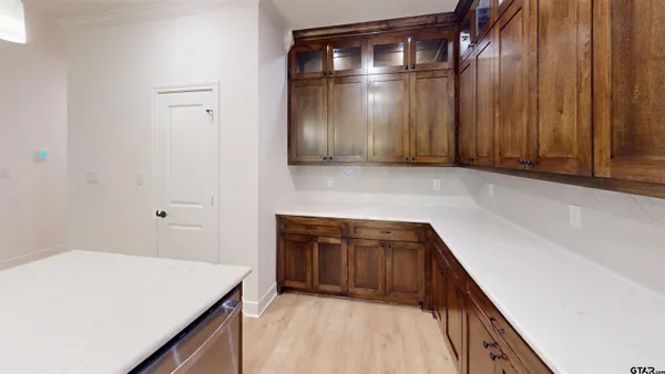 a kitchen with a sink and cabinets