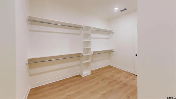 a view of an empty walk in closet