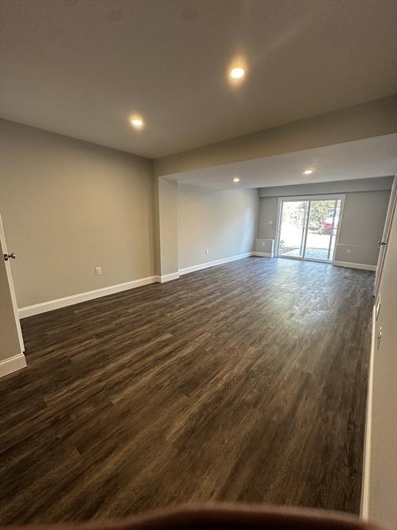 56 Dudley Road Billerica, MA 01821 - Photo 24 of 29 an empty room with wooden floor and windows