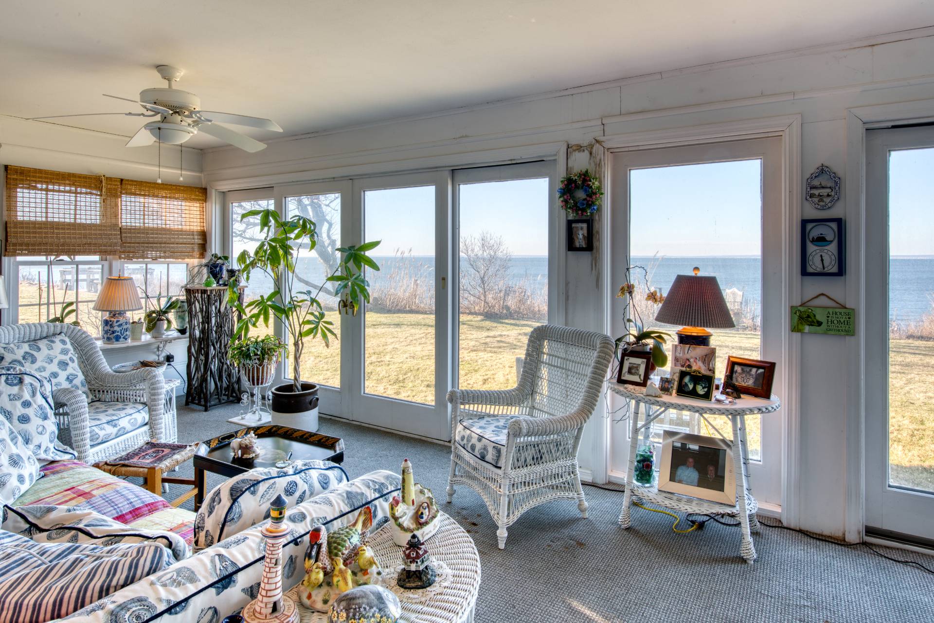 335 Sound View Road Orient, NY 11957 - Photo 15 of 22 a bedroom with furniture and a floor to ceiling window