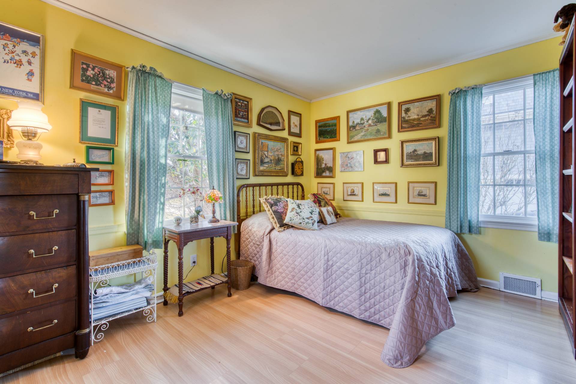 335 Sound View Road Orient, NY 11957 - Photo 20 of 22 a bedroom with a bed and a dresser next to a window