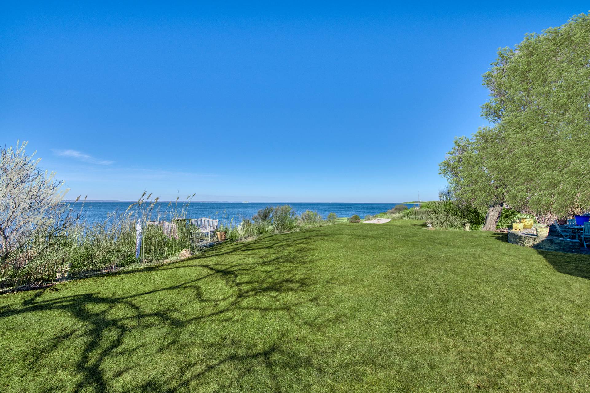 335 Sound View Road Orient, NY 11957 - Photo 7 of 22 a view of an ocean and a yard