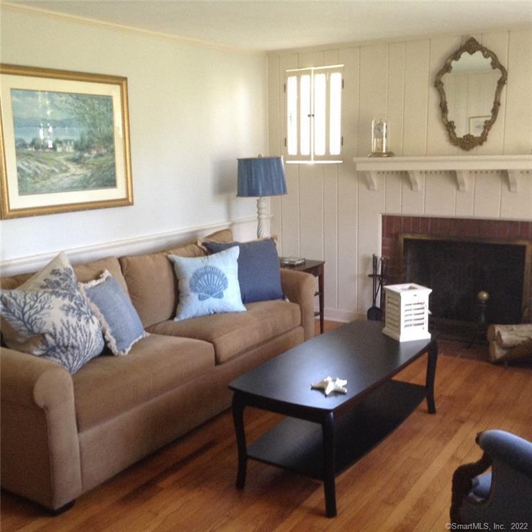 22 Fairview Avenue Madison, CT 06443 - Photo 11 of 31 a living room with furniture and a fireplace