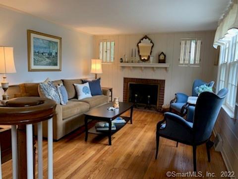 22 Fairview Avenue Madison, CT 06443 - Photo 13 of 31 a living room with furniture and a fireplace
